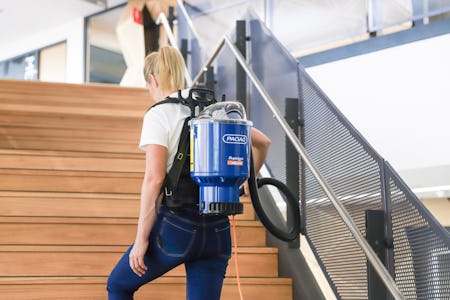 girl wearing wispa backpack vacuum cleaner