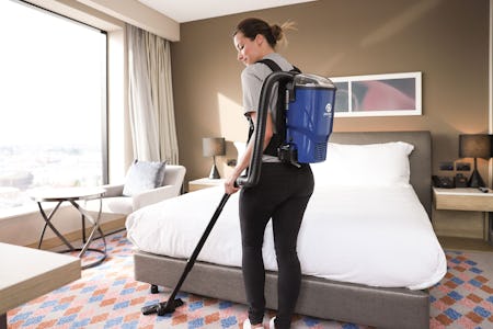 girl wearing velo backpack vacuum