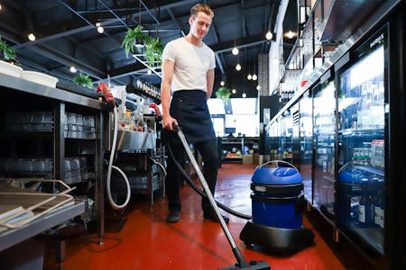 guy vacuuming with hydropro 21 wet & dry vacuum